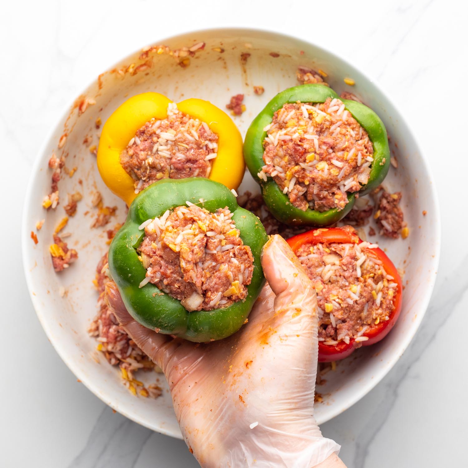 Meat and rice filling stuffed inside of bell peppers.