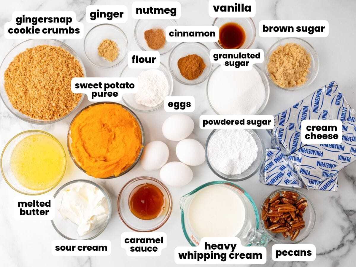 The ingredients needed to make sweet potato cheesecake with gingersnap crust and whipped topping, in separate bowls, arranged on a counter.