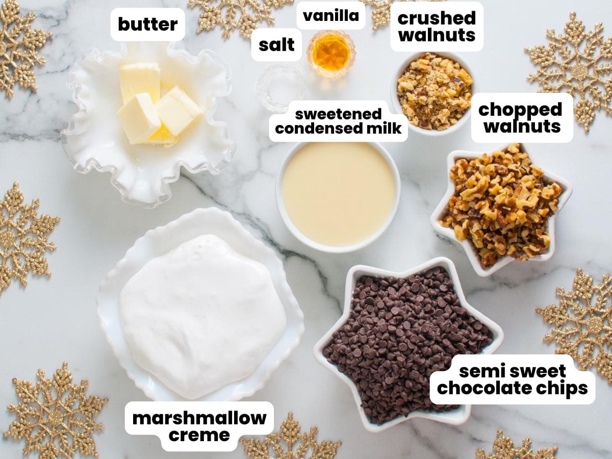 The ingredients for fantasy fudge, all measured into star shaped dishes. Gold snowflakes decorate the background.