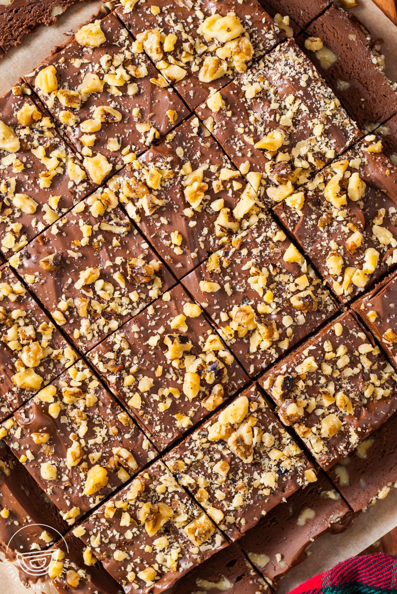 chocolate fudge cut into neat, even squares. The rounded edges are cut off first.