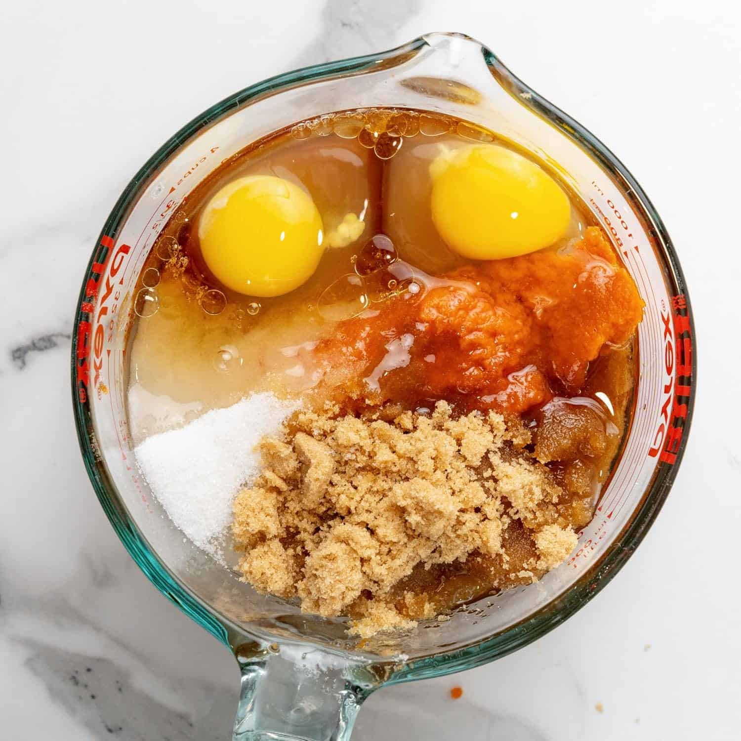 eggs, pumpkin sugar, melted butter added to a large pyrex measuring cup.