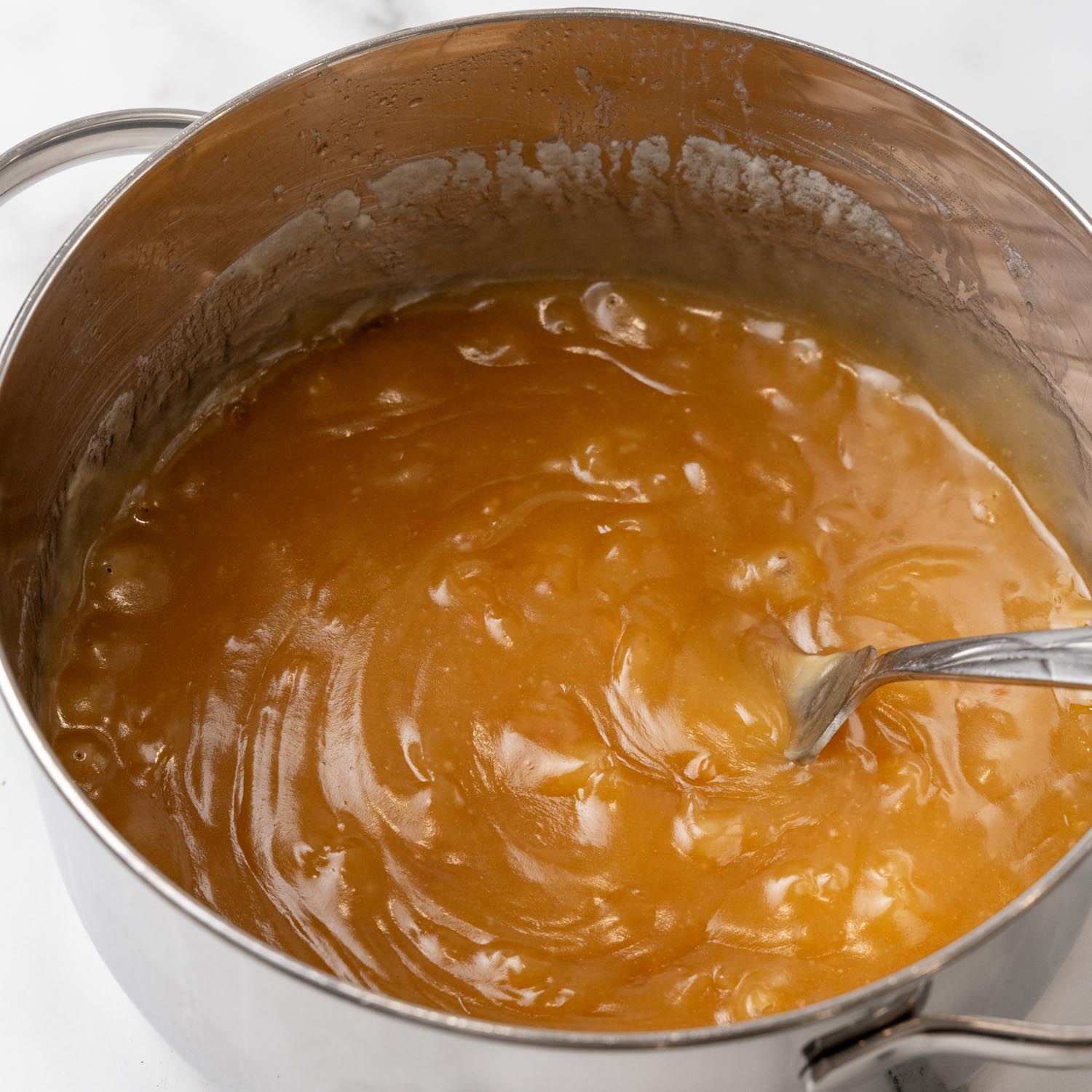 cooked caramel sauce for apple slab pie in a large saucepan.