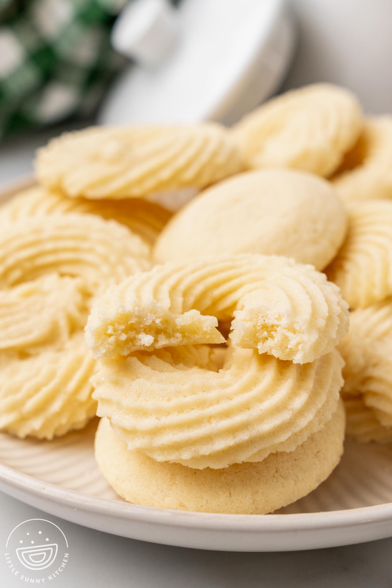 a platter of round, fluted danish butter cookies.