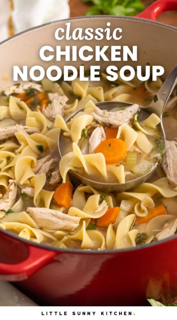 a red dutch oven filled with hearty chicken soup with egg noodles. Text overlay says "classic chicken noodle soup"