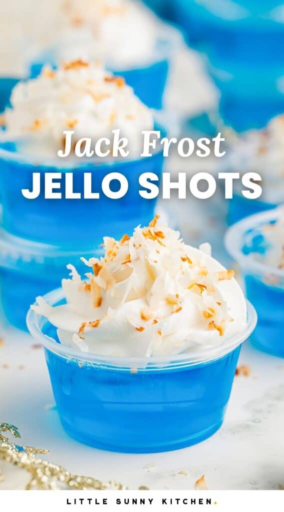 blue jello shots topped with whipped cream and toasted coconut. Text overlay says "jack frost jello shots"