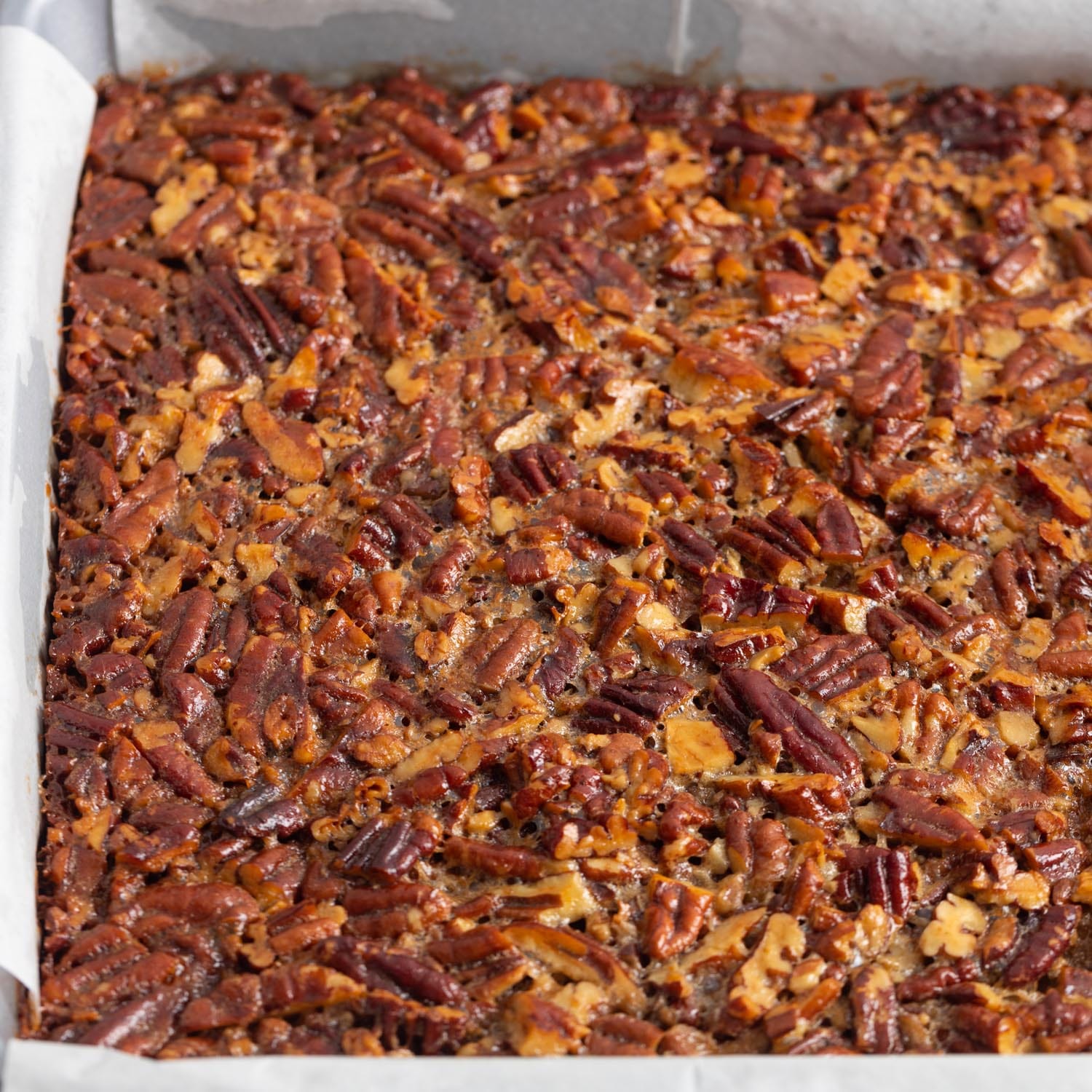 a baked pan of pecan pie bars.