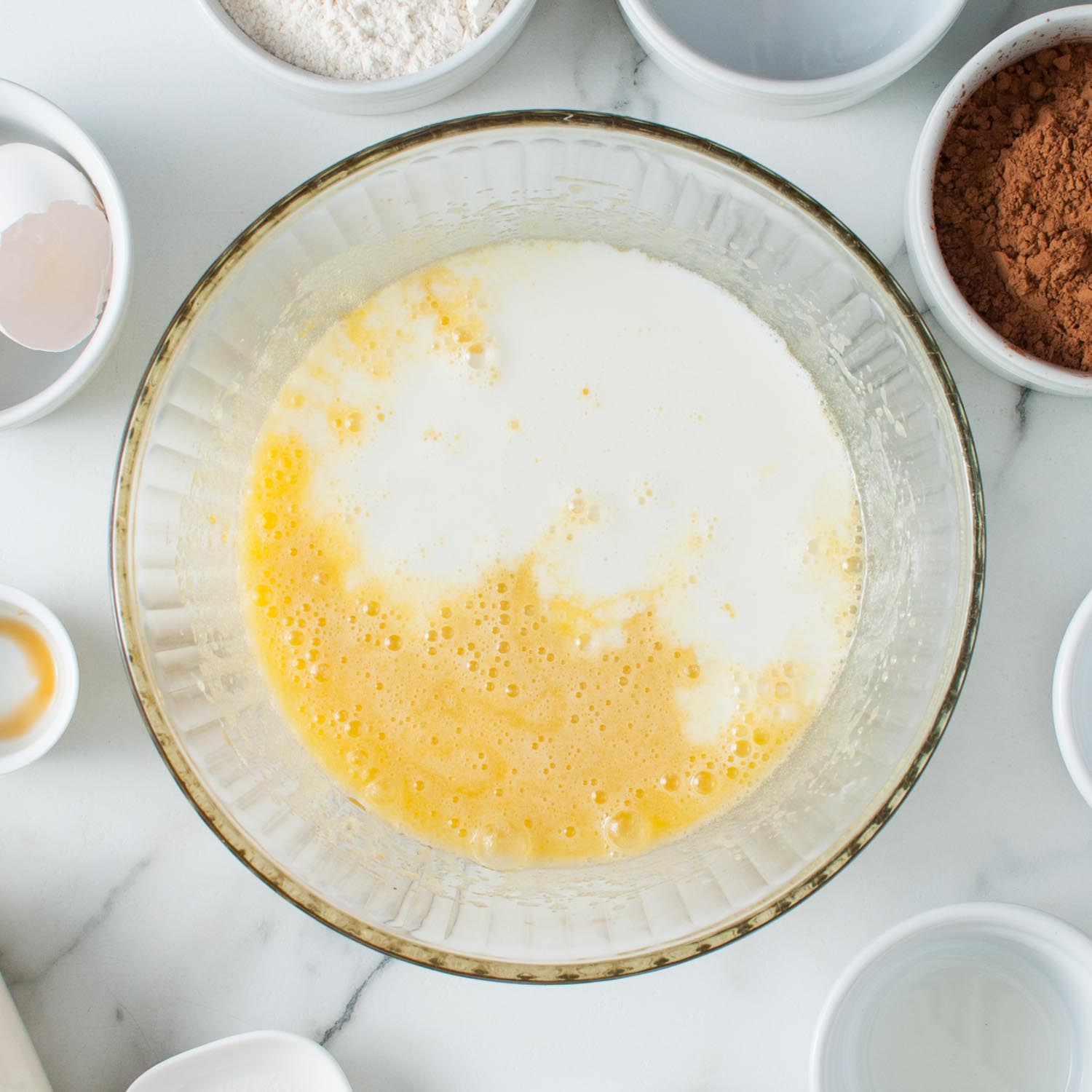 milk added to wet ingredients for cupcakes.