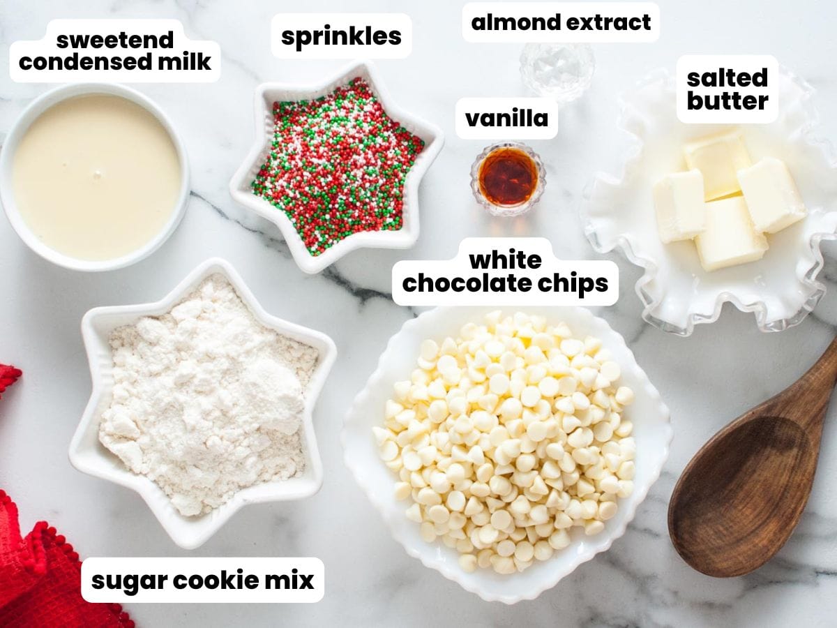 Ingredients for making easy sugar cookie fudge, measured into star shaped small bowls.