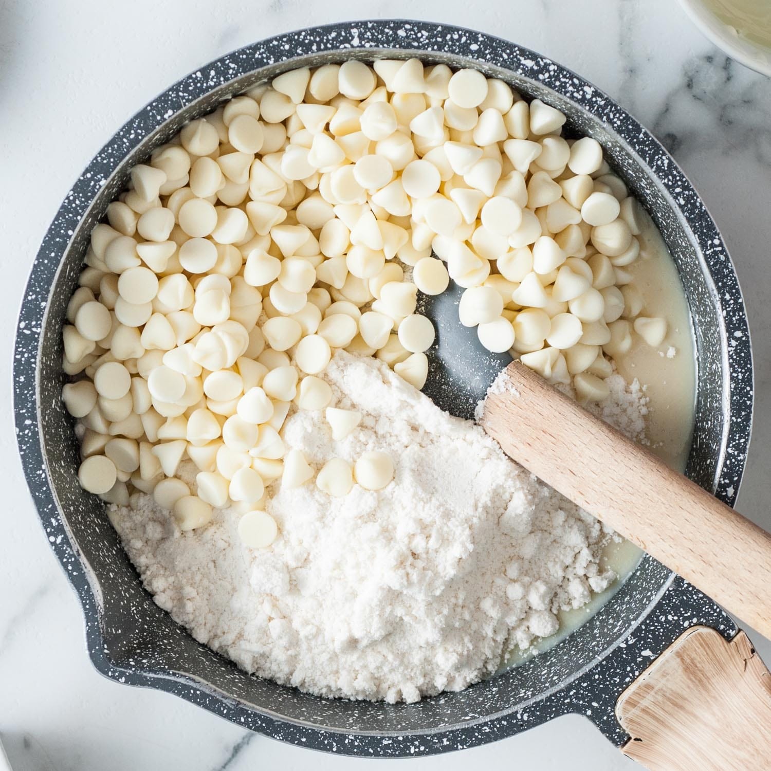 white chocolate chips and sugar cookie mix stirred into sweetened condensed milk.