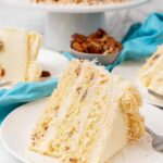 a slice of Italian Cream cake on a plate.