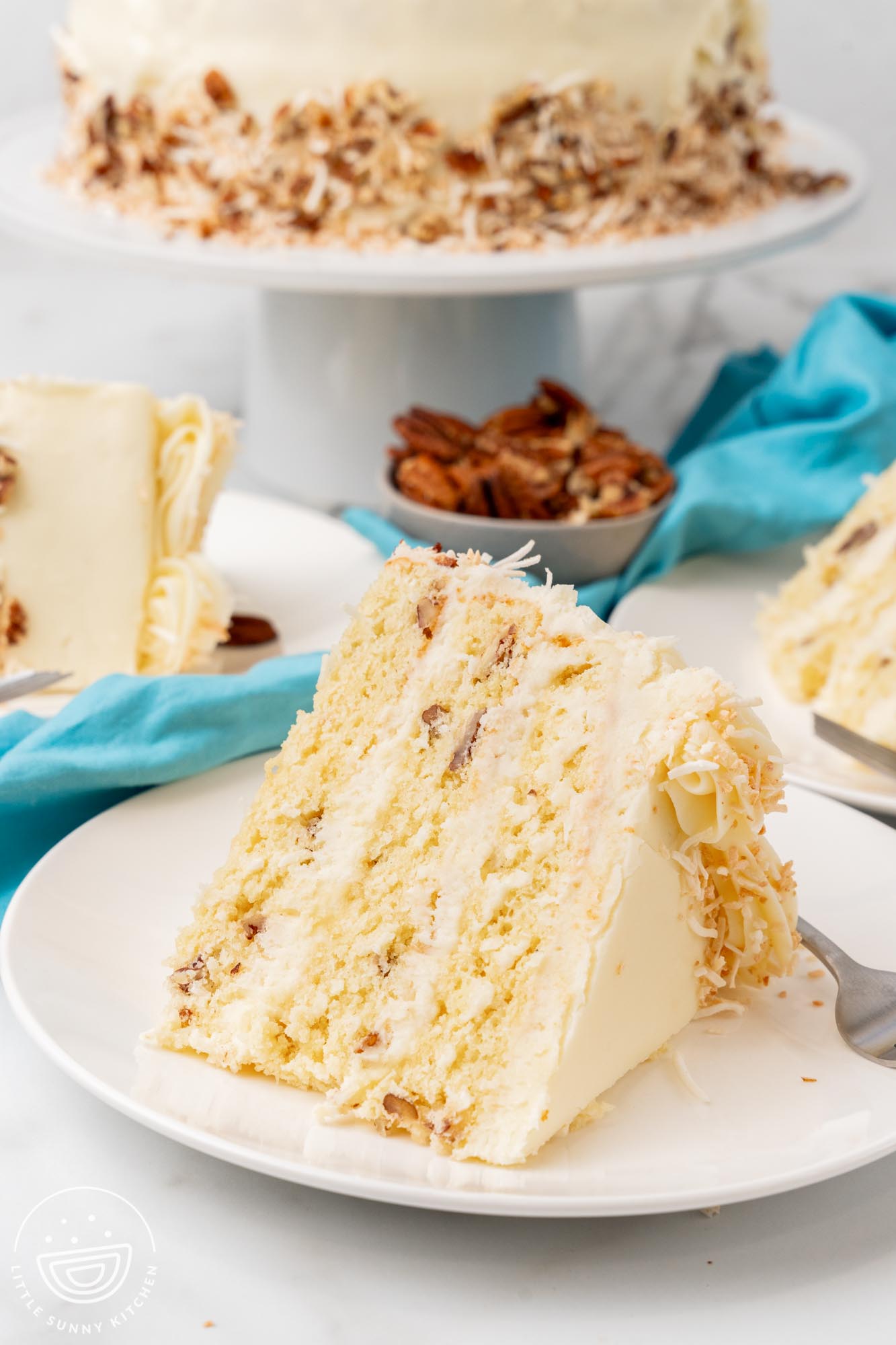 a slice of Italian Cream cake on a plate.