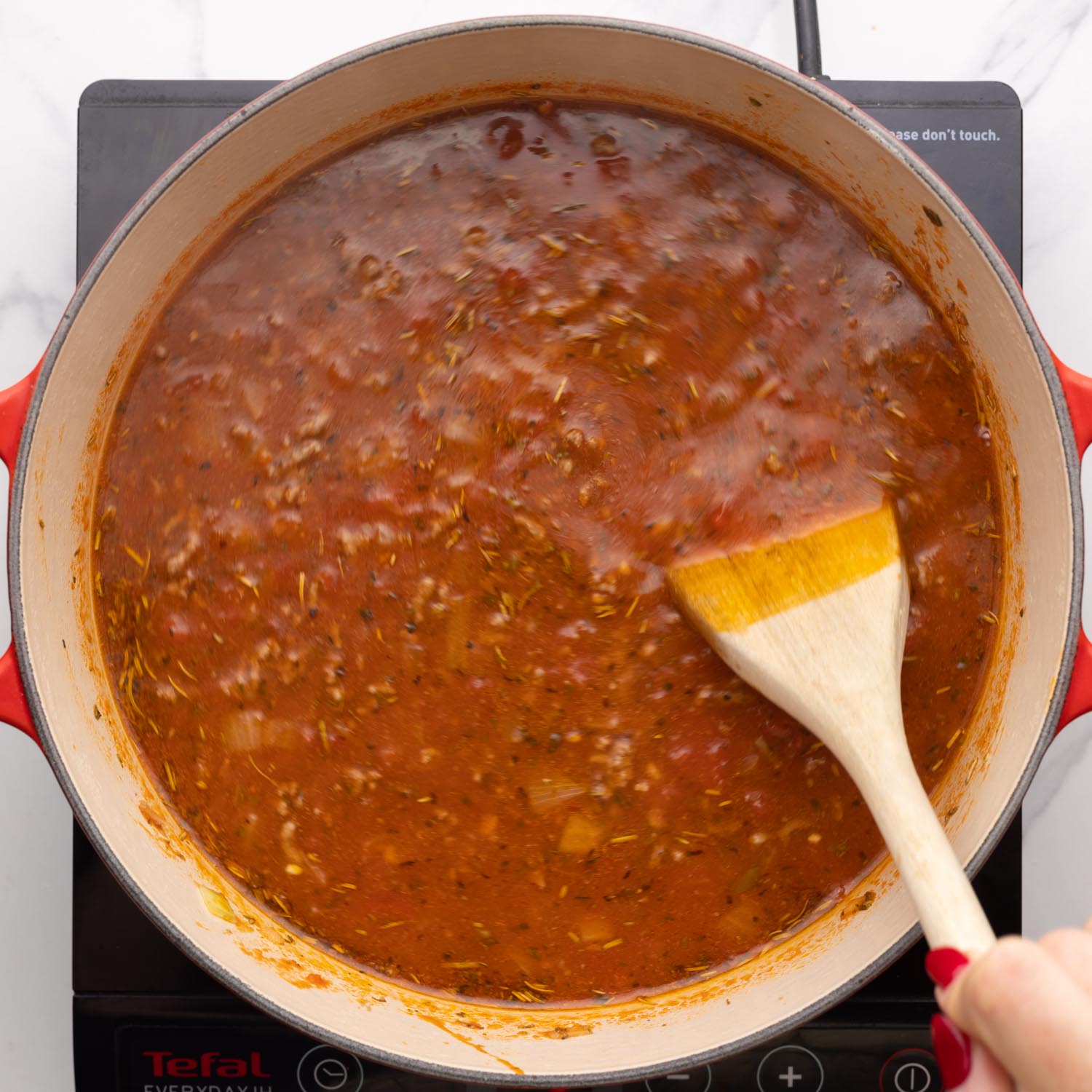 chicken broth added to cooked ground beef and marinara for lasagna soup