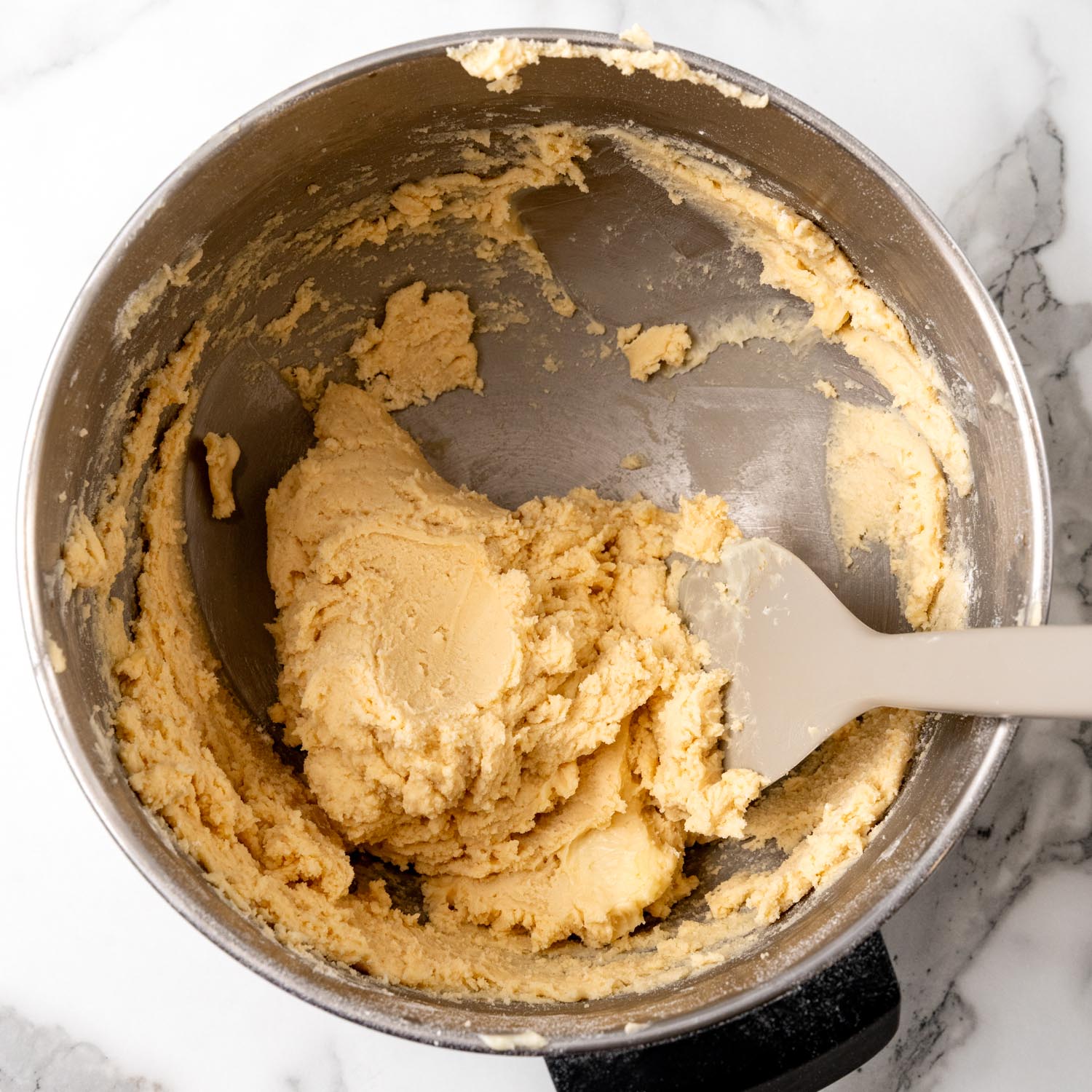 shortbread cookie dough in the bowl of a stand mixer.