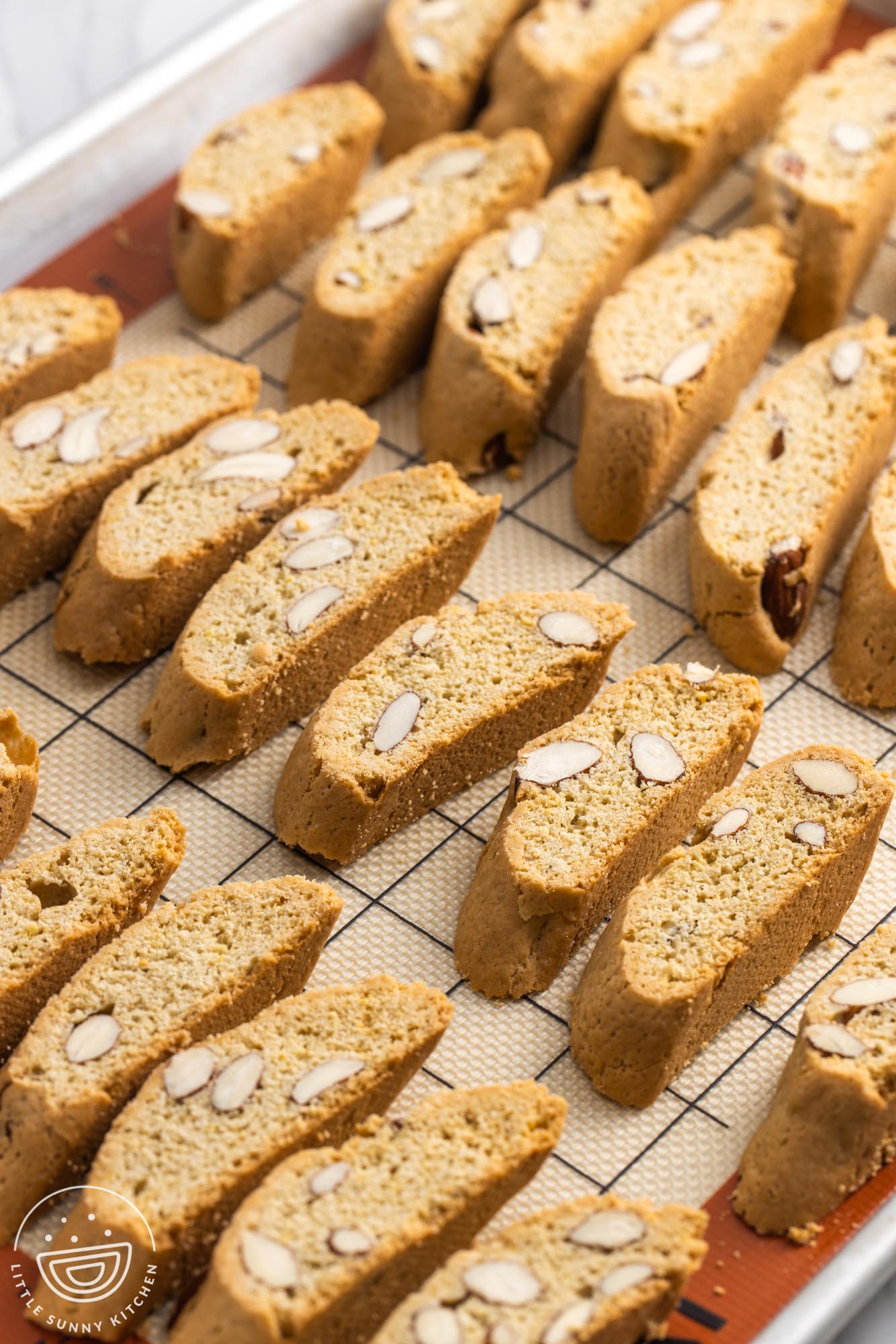 cantucci biscotti on a baking sheet, after the second bake.