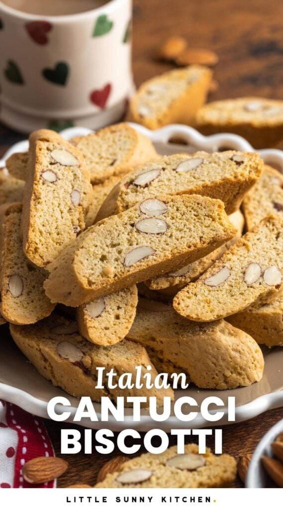 a white plate of cantucci with almonds in front of a cup of coffee. Text overlay says "Italian Cantucci Biscotti"