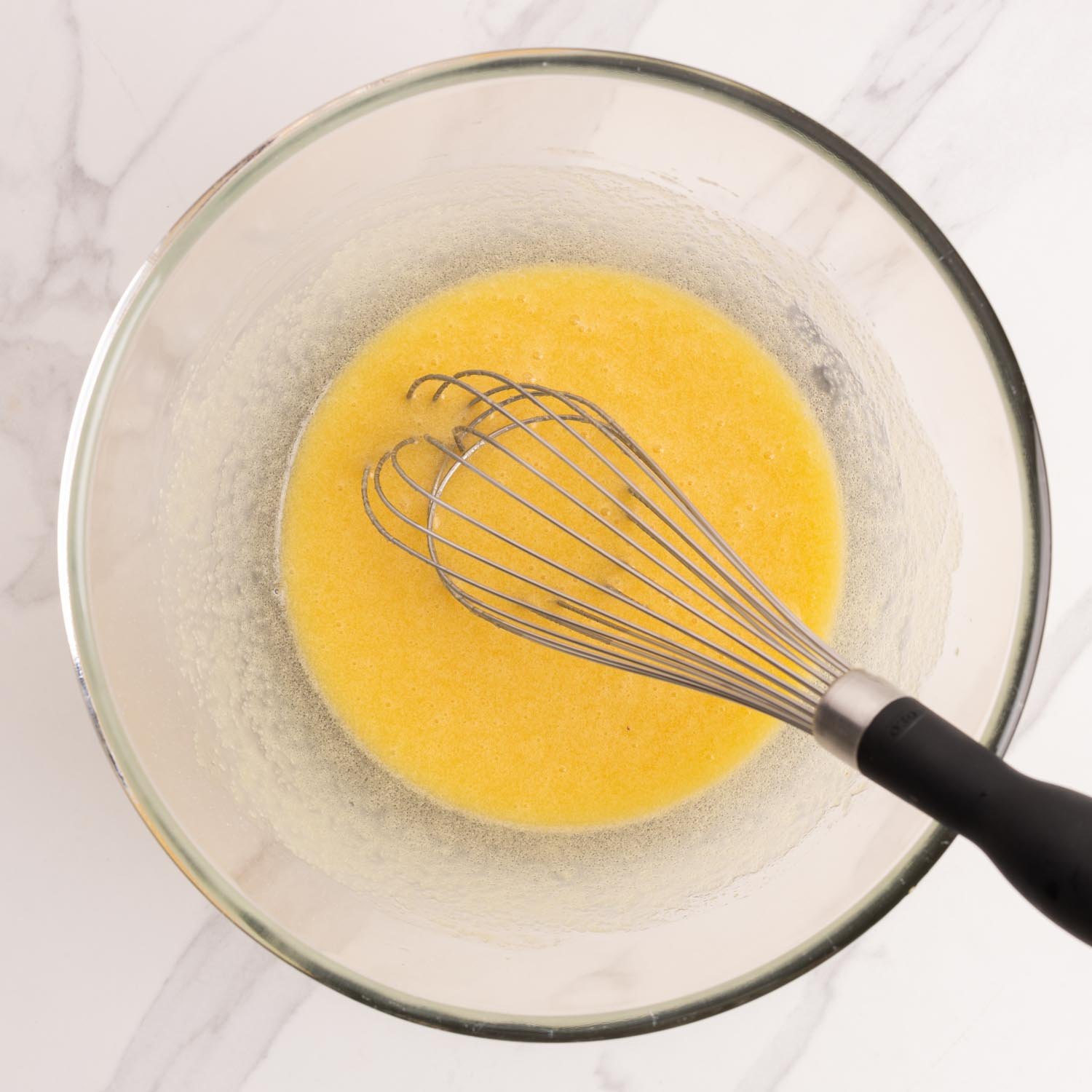 melted butter and eggs, sugar, whisked in a mixing bowl.