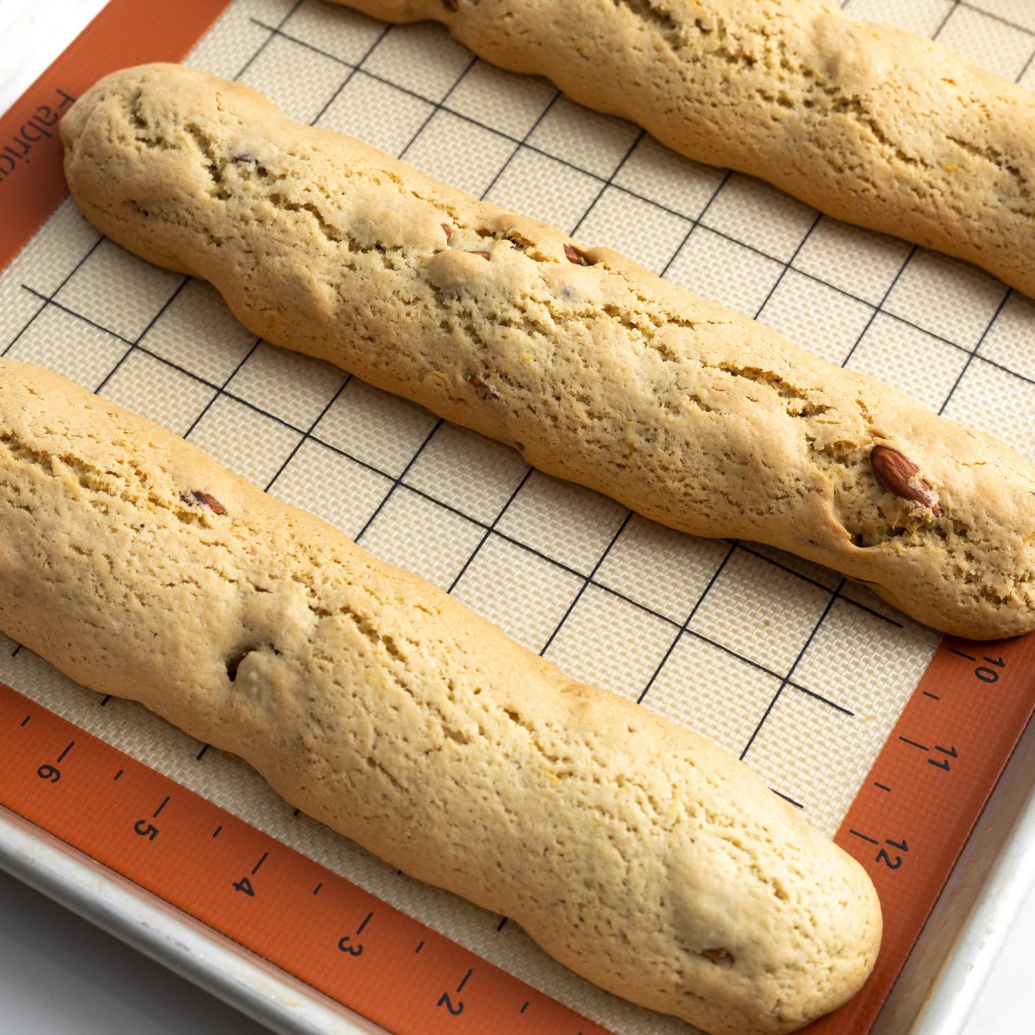 baked cantucci logs on a silpat mat.