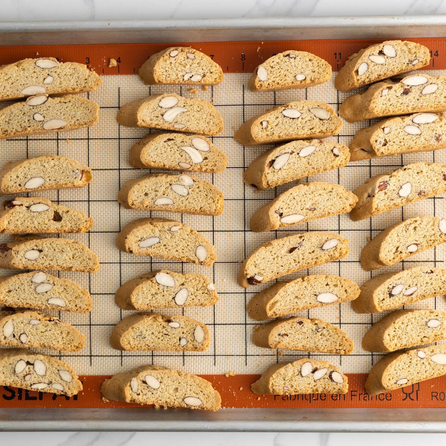 mini almond biscotti on a silpat mat.