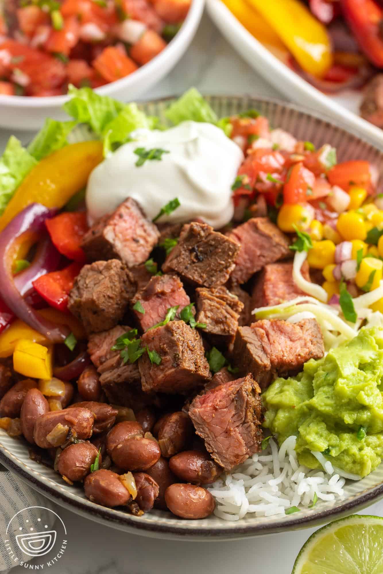 closeup of a homemade chipotle steak burrito bowl with all the toppings.