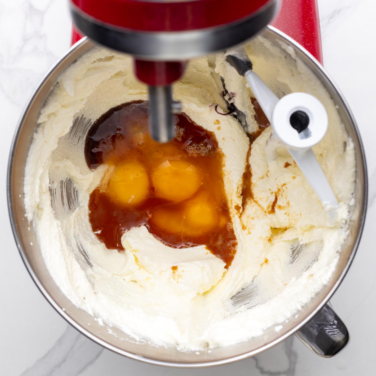 eggs and vanilla added to creamed butter and sugar in a mixer.