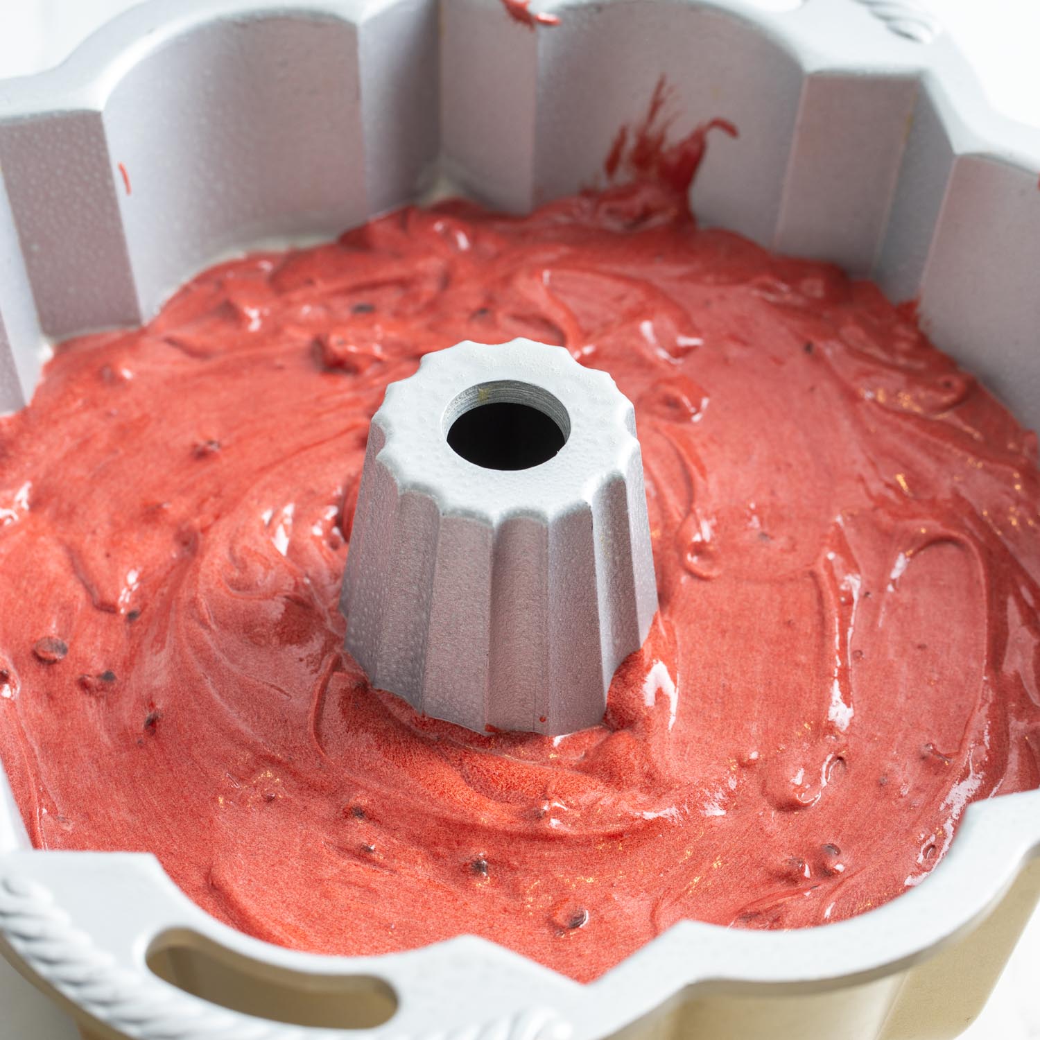 red velvet pound cake batter in a bundt pan.