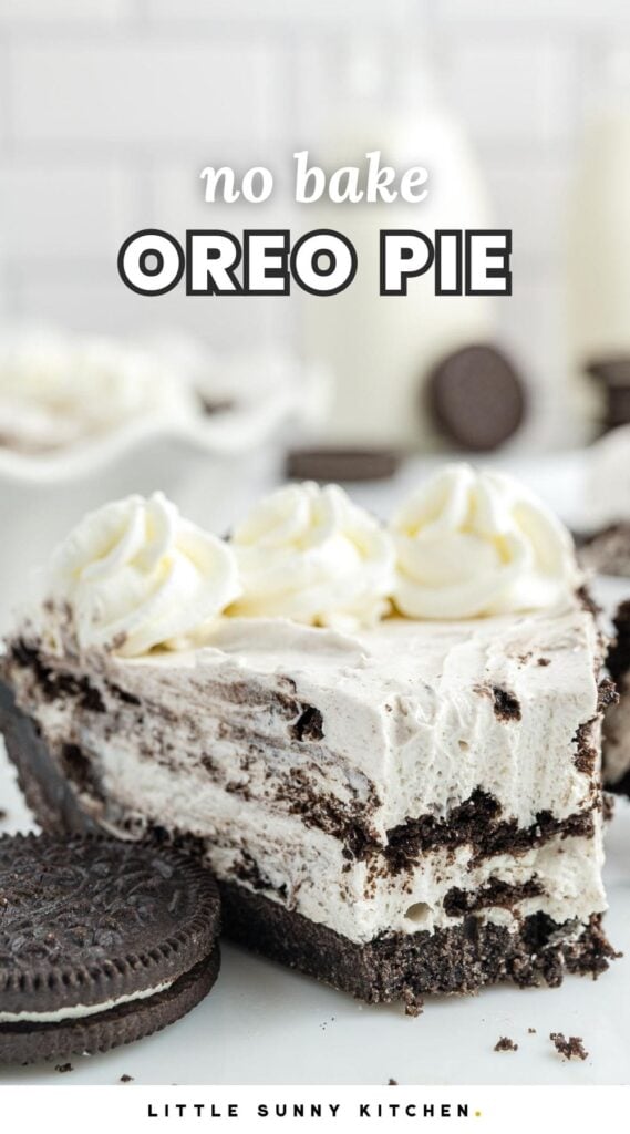 A slice of no-bake Oreo pie with a chocolate cookie crust, creamy Oreo filling, and whipped cream swirls on top, garnished with whole Oreo cookies. Text overlay reads "no bake OREO PIE." Background includes milk bottles and additional cookies.