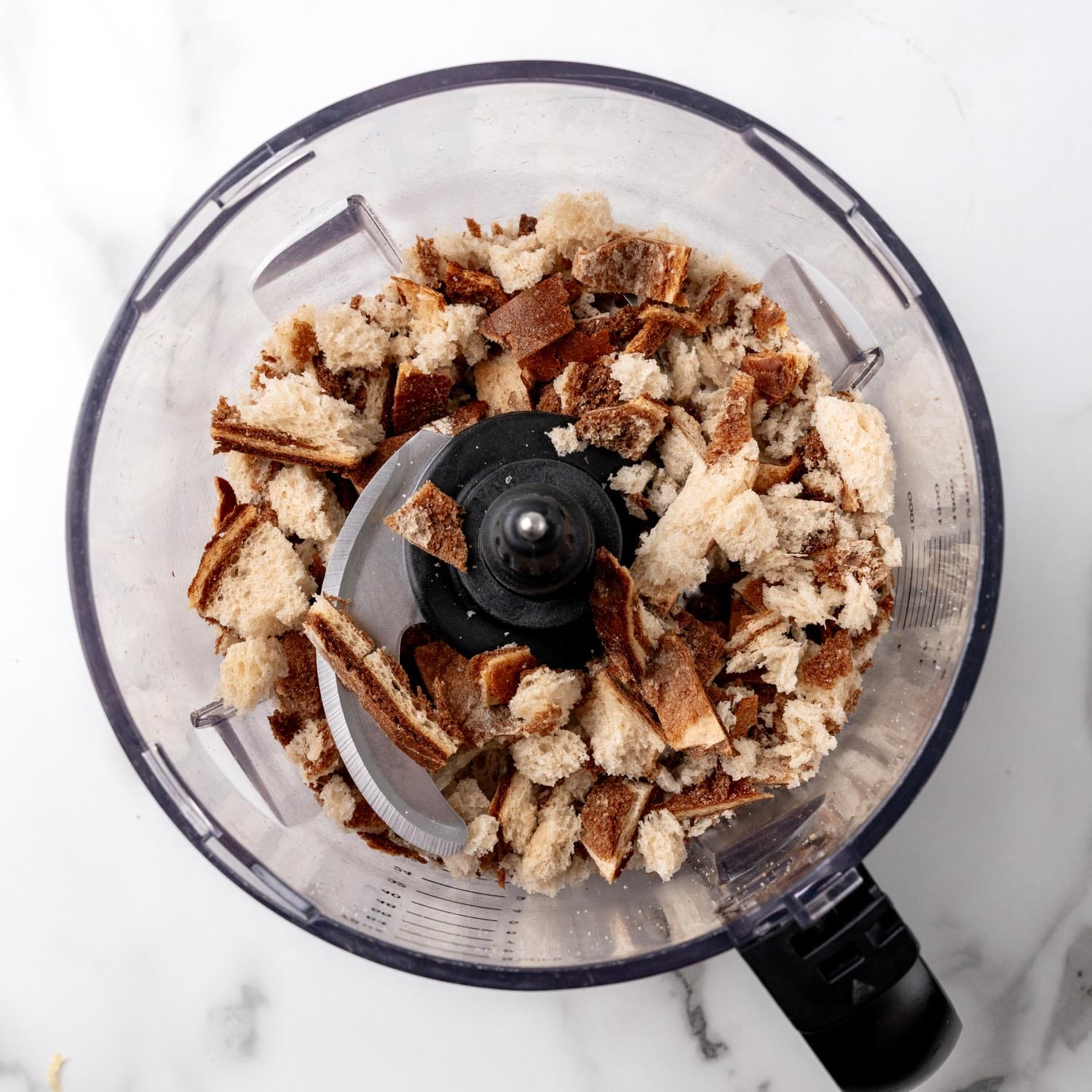 Marble rye bread in a food processor, chopped coarsely to make large crumbs.