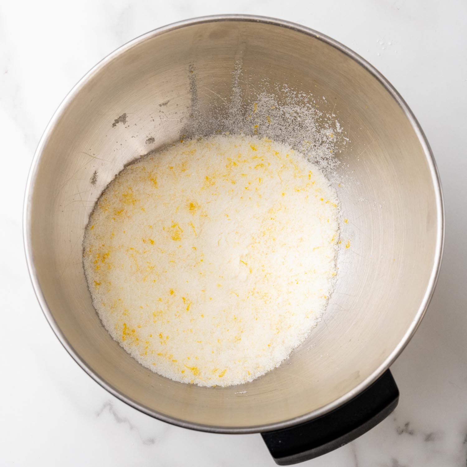 sugar and lemon zest in the bowl of a stand mixer. 