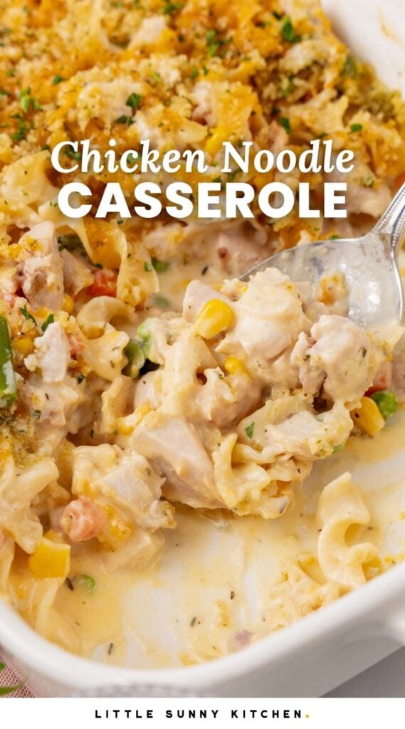 Casserole with egg noodles and chicken in a white ceramic dish. Text overlay says "Chicken noodle Casserole" in white letters.