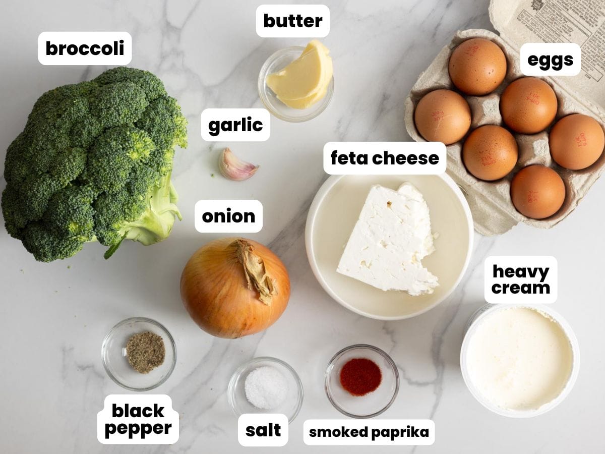 Ingredients for making a crustless broccoli quiche with feta cheese and onion.