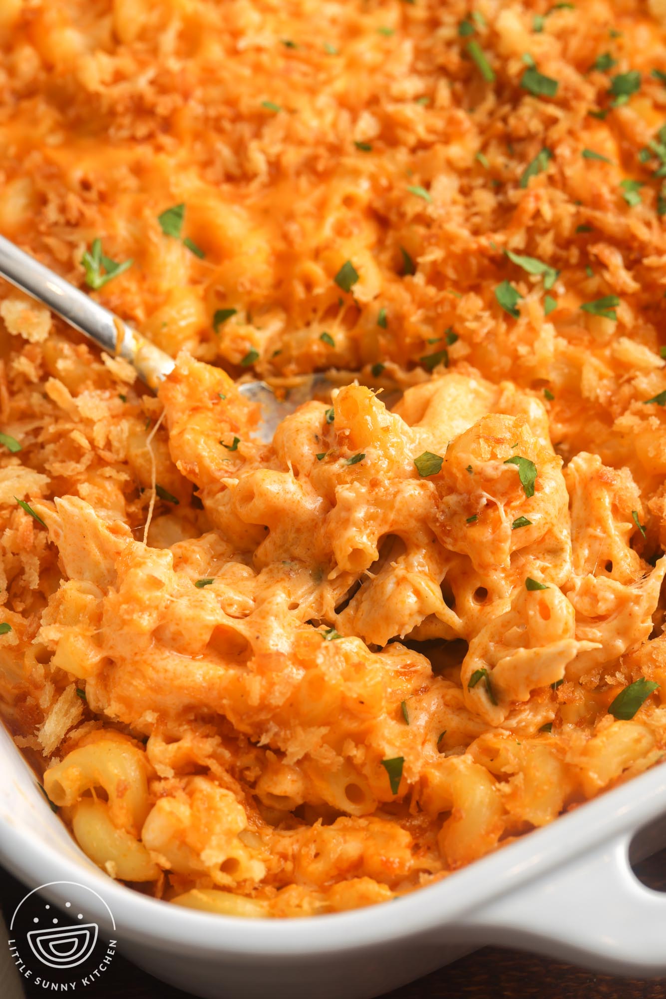 closeup of a pan of baked buffalo chicken mac and cheese.