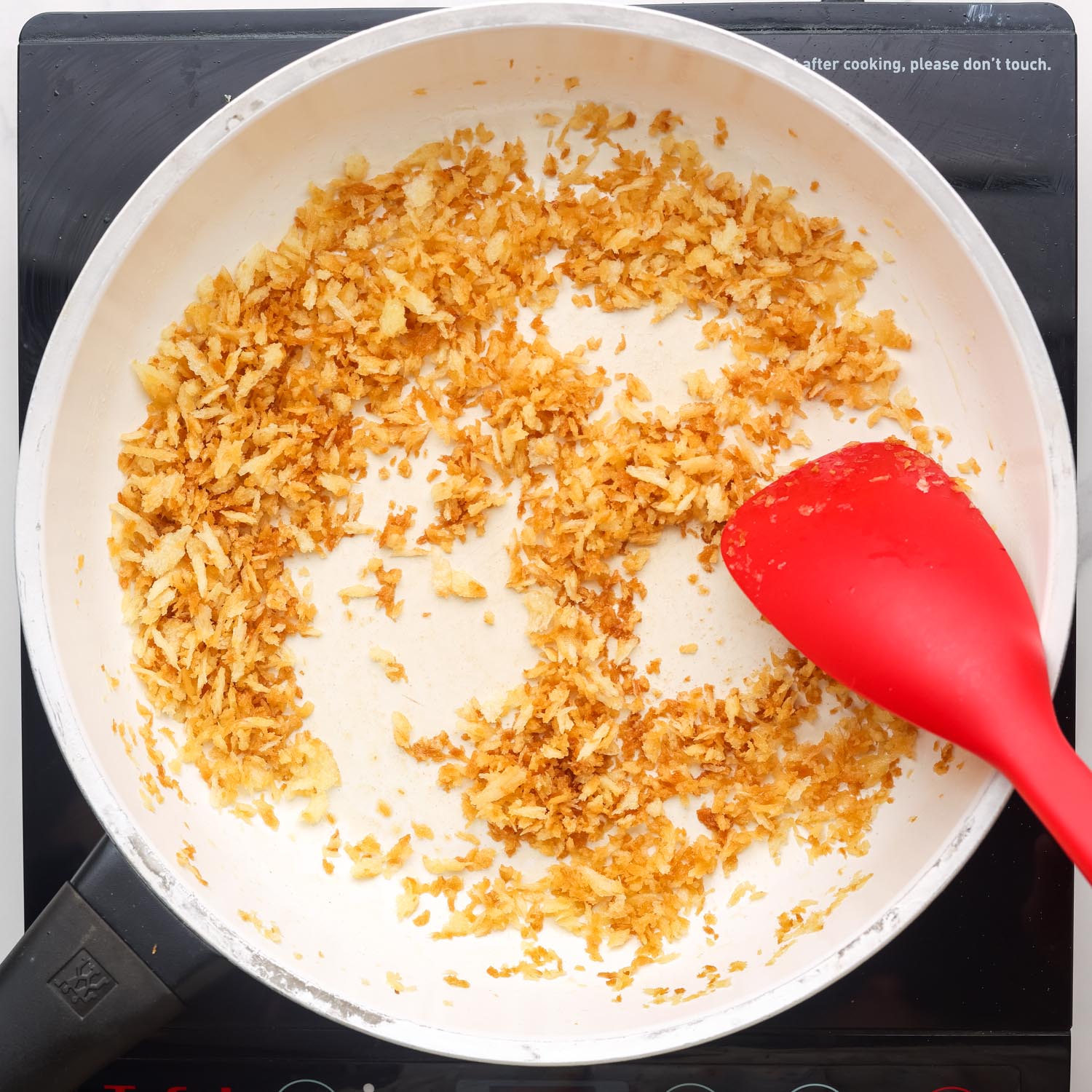 panko breadcrumbs toasting in a skillet.