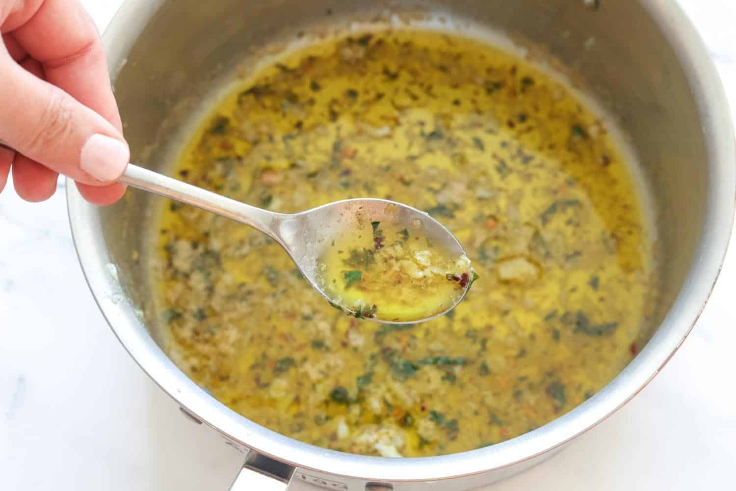 amogio sauce for chicken spiedini in a metal saucepan.