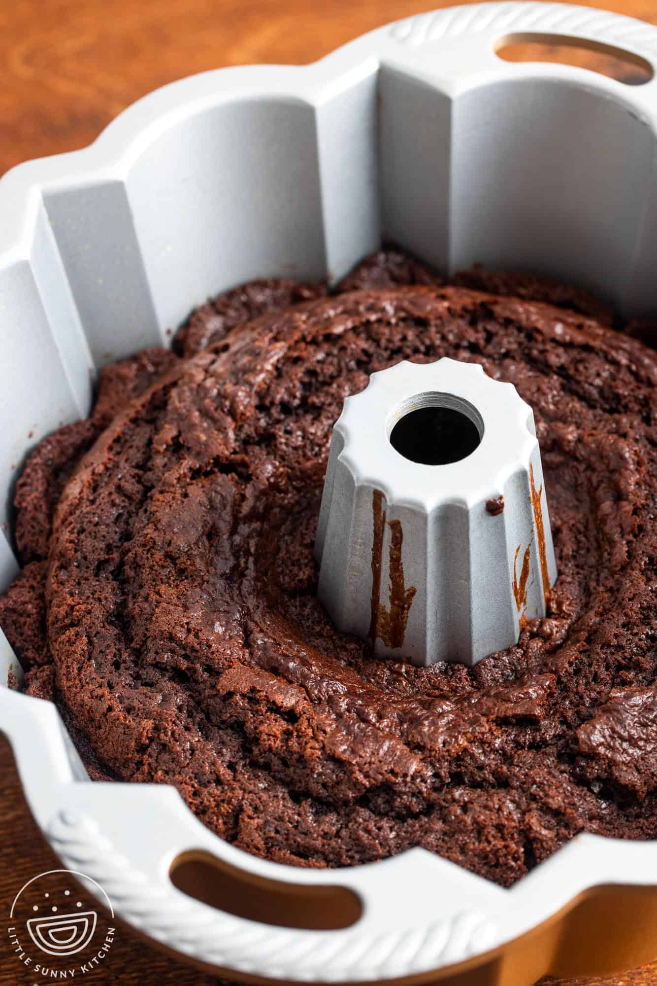 chocolate bundt cake baked in a large bundt pan.