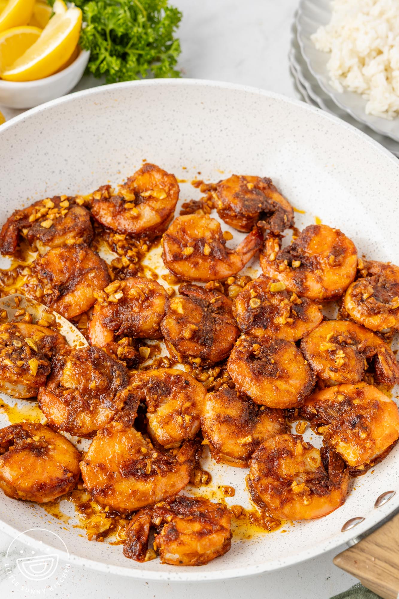 a skillet of hawaiian garlic shrimp.