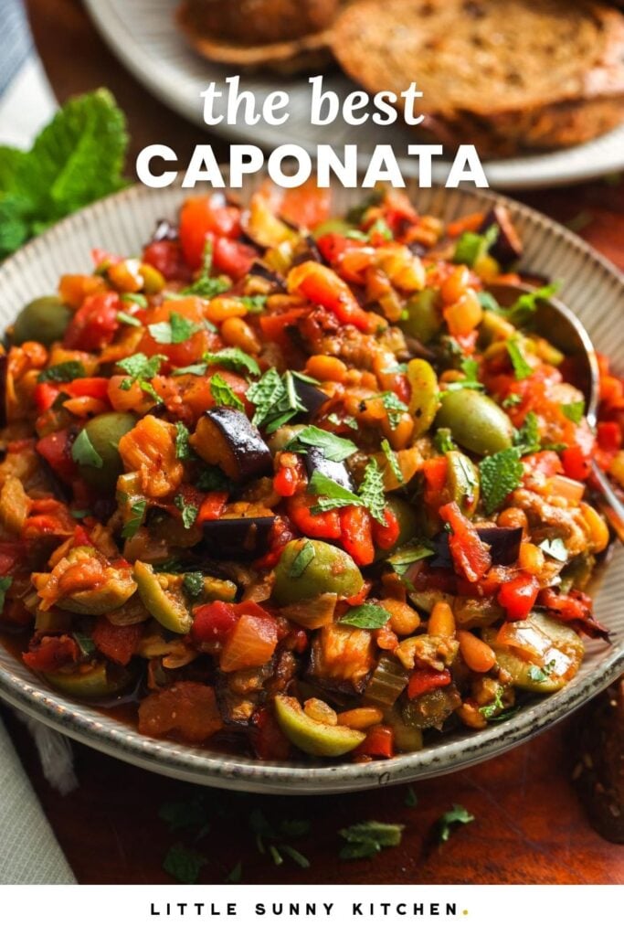 a ceramic bowl of caponata made with eggplant and olives. Text overlay says "the best caponata"