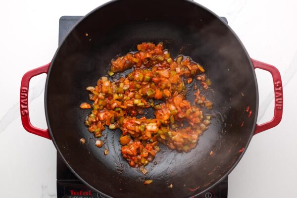 sauteed onion and celery with seasonings in a large skillet.