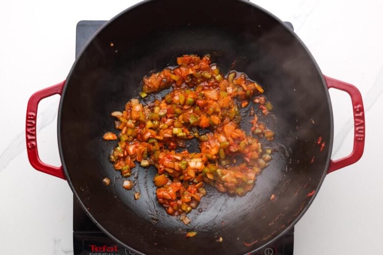 sauteed onion and celery with seasonings in a large skillet.