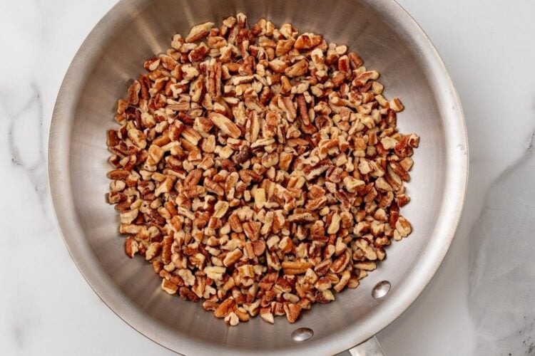chopped pecans in a skillet, toasting.
