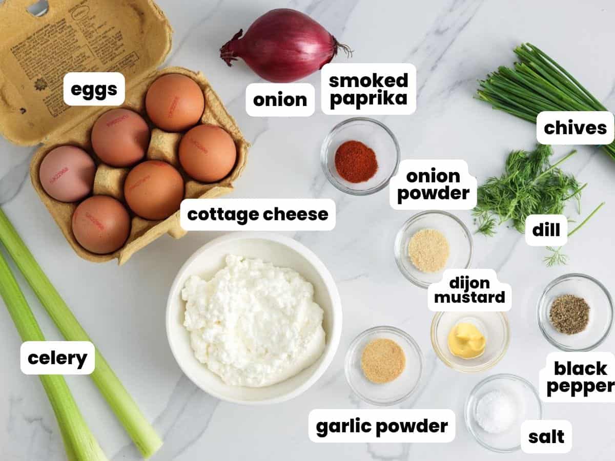 Ingredients for high protein cottage cheese egg salad with celery, chives, dill, and red onion.