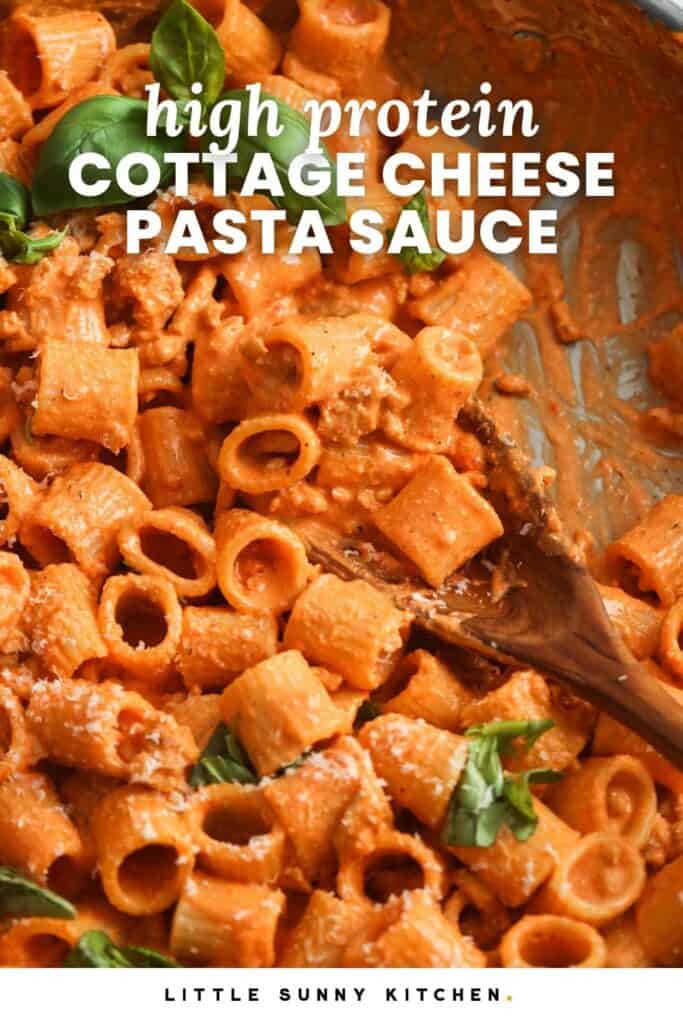 small rigatoni in a creamy pink sauce with ground chicken. Text overlay says "high protein cottage cheese pasta sauce"