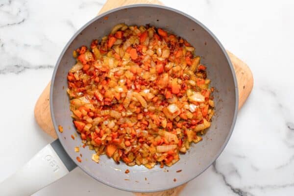sauteed onion and carrot in a small nonstick frying pan.