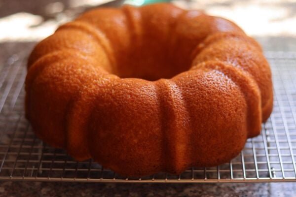 a cooked bundt cake, cooling on a wire rack.