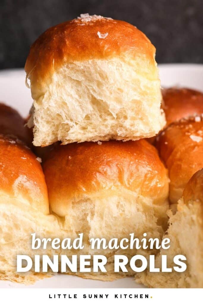 fluffy dinner rolls, viewed from the side. Text overlay says "bread machine dinner rolls"