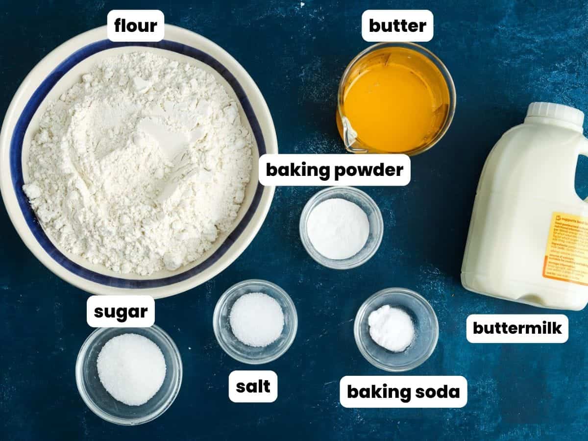 Ingredients measured for butter swim biscuits recipe, including flour, melted butter, and buttermilk.