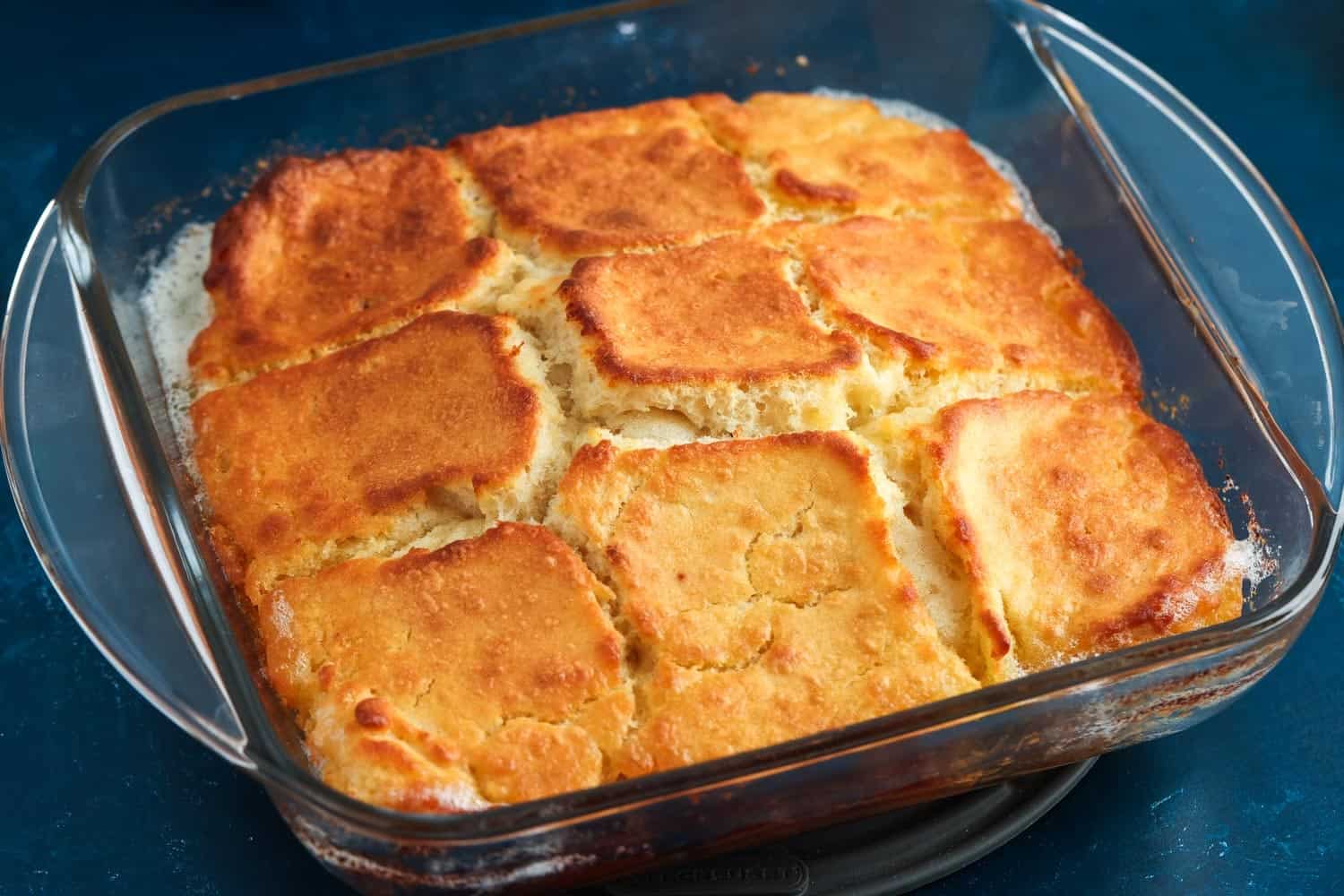 baked butter swim biscuits in a square glass pan.