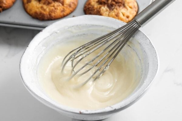 icing whisked together in a small ceramic bowl.