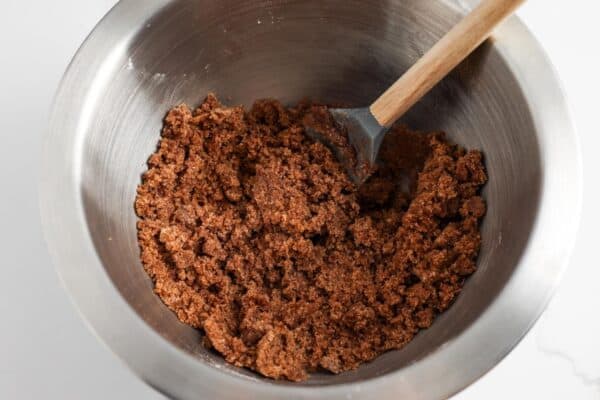cinnamon, brown sugar, flour, and butter mixed together in a small metal bowl.