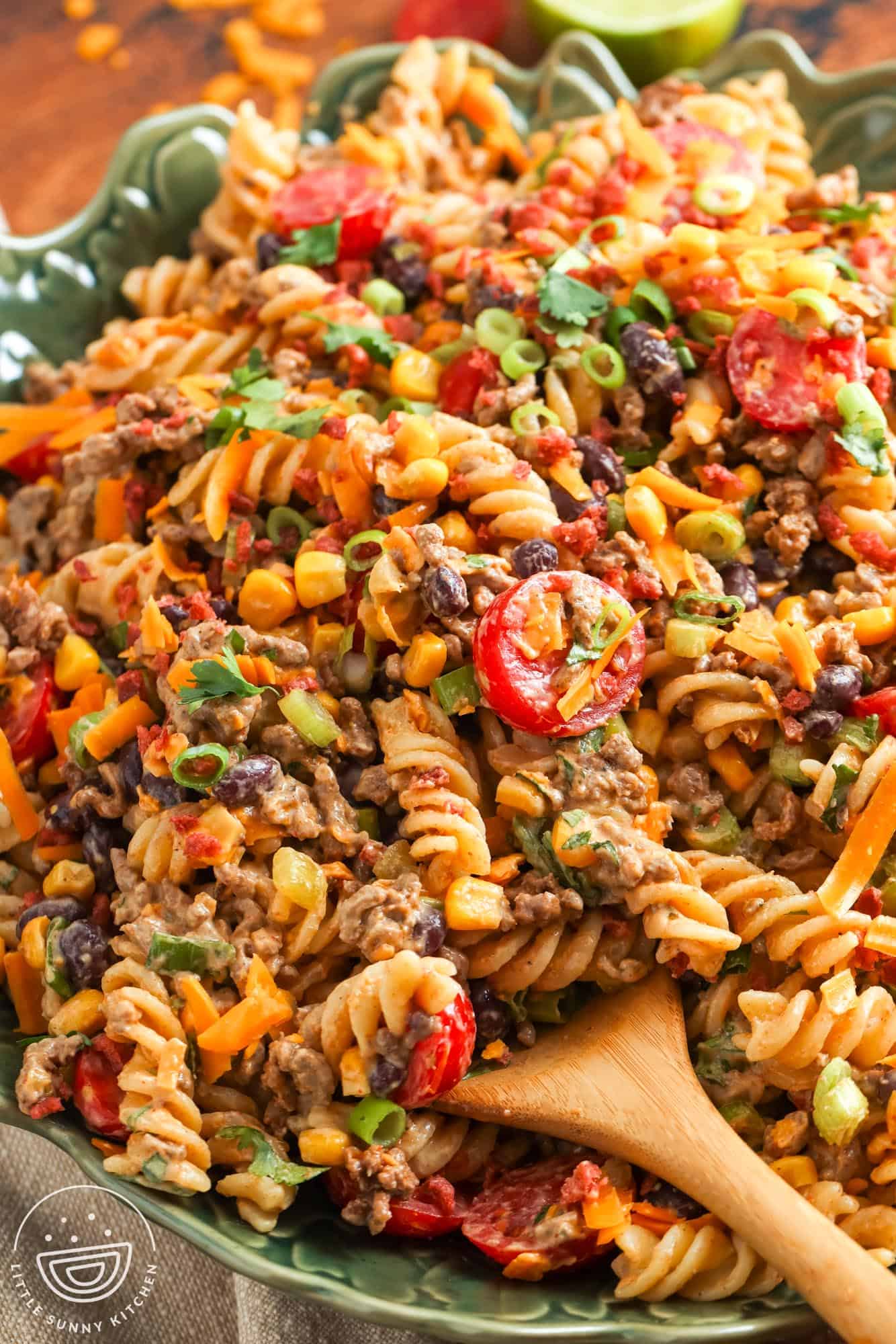 closeup of a bowl of cowboy pasta salad made with rotini noodles.