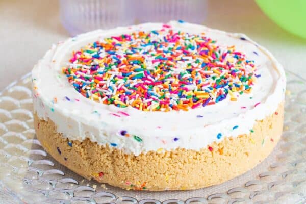 funfetti cheesecake with extra sprinkles added to the center, leaving a 1 inch border.